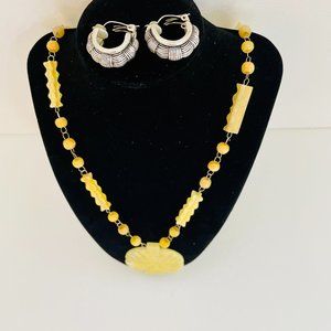 Genuine yellow jade Japanese Warrior Pendant hanging on carved yellow jade beads